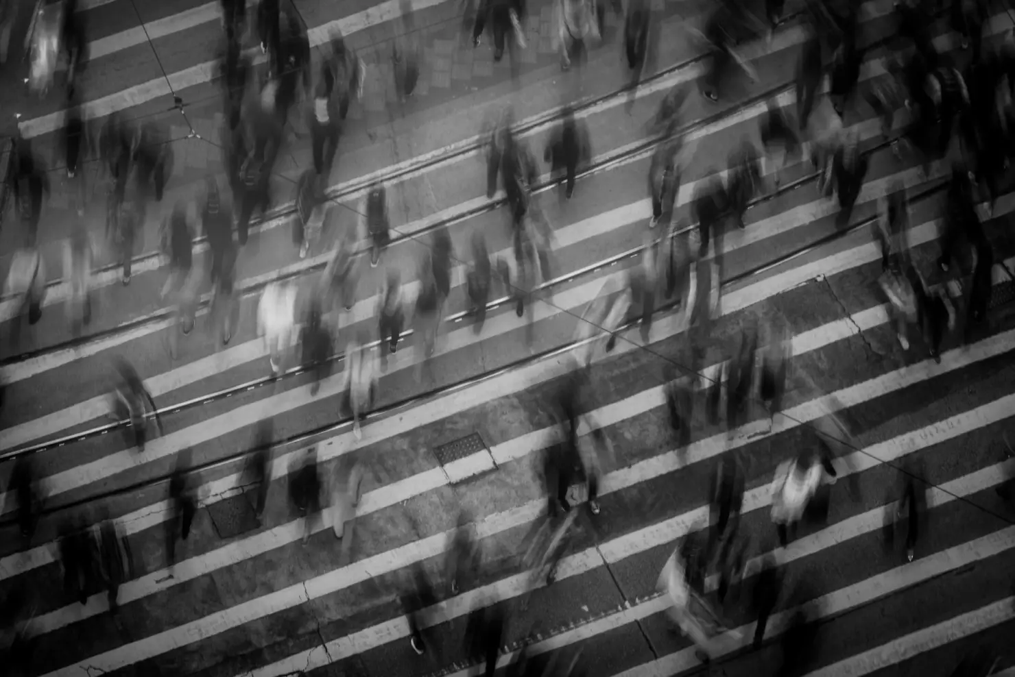Pedestrians crossing a Guelph street, motion-blurred
